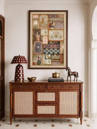 The Kahani Indian Art Theme vertical wall art framed above a wooden cane sideboard styled with a brass horse and lamp.