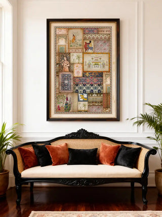 A large-scale Kahani art piece framed above a black and cane vintage sofa with plush velvet cushions.
