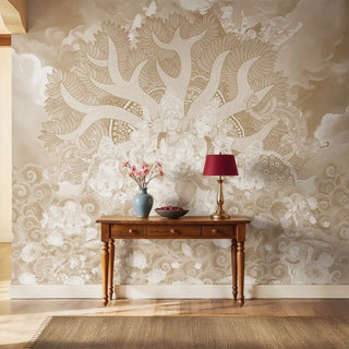 Traditional Indian wall mural of Shiva and family in beige tones behind a wooden console table.