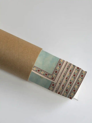 A section of the Kanha Vintage art showing the striped decorative border partially unrolled from a shipping tube.