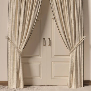 The Kantha Pipin curtain hanging in a room, showing its elegant drape and how the subtle pattern frames the doorway.