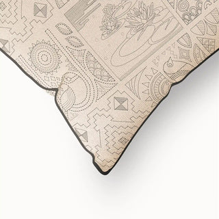 A close-up of the "Kantha Pipin" cushion cover's corner, highlighting the clean, dark piped edge and the intricate linear details of the artisanal pattern.