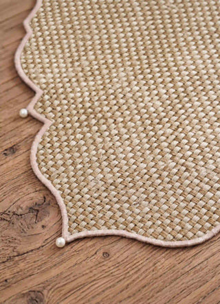 A macro close-up of the Kasbah Pearl Jute Runner's two-tone jute weave and pearl-beaded scalloped edge.