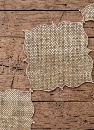 The Kasbah Pearl Jute Runner styled with crystal candelabras and gold-rimmed place settings on a dark wood table.