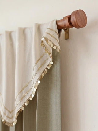 A close-up detail showing the premium sage green herringbone weave texture of the Kashmiriyat curtain fabric.