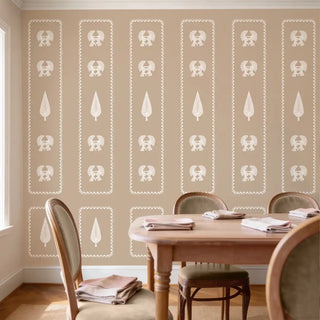 A luxury formal dining setting featuring the Kavya wallpaper behind a wooden table and upholstered chairs.