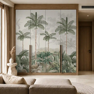 Kovalam tropical wallpaper in green applied across four wooden-framed wardrobe panels beside a low sofa in a sunlit room