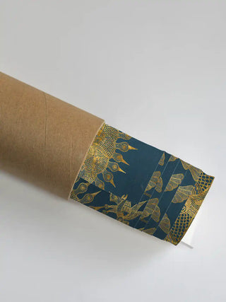 A close-up of the Geet Madhubani artwork showing the golden sun motif as it is unrolled from a premium shipping tube.