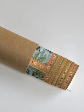 A close-up of the Raga Rama artwork being unrolled from a premium cardboard shipping tube.