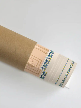 A section of the Mughal Garden mural showing the decorative border and ivory pattern partially unrolled from its protective shipping tube.