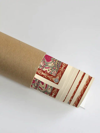 Close up of the Netri mural details and floral borders emerging from a protective rolled packaging shipping tube.