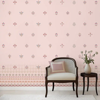 Decorative room with pink floral wallpaper, a chair, and a small table with a vase.