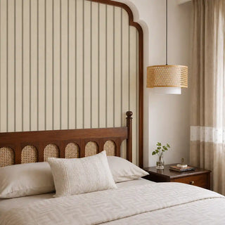 The Linear Harmony beige black wallpaper mural installed on a feature wall in a bedroom with a dark wood cane headboard and rattan pendant light view-bedroom