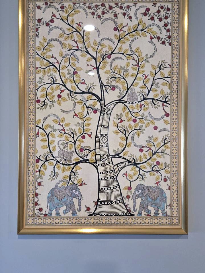 Tree of life wall art print in a gold frame in a customer's hallway