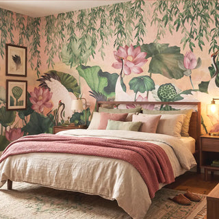 A luxury bedroom featuring the Lotus Garden mural in blush pink and sage behind a walnut bed with linen bedding view-bedroom