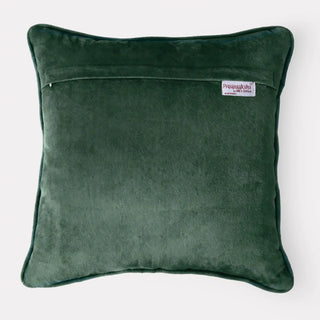 The reverse side of the Jhalak green velvet cushion cover showing the hidden zipper and brand tag.
