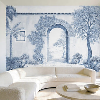 A sophisticated living room featuring The Silent Portico mural behind a curved cream sofa and marble coffee table.