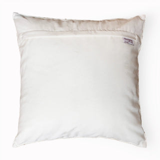 The reverse side of a luxury cream velvet cushion cover showing the quality stitching and hidden zipper.