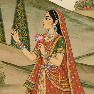 A detailed close-up of the Madhav Madhuban wallpaper showing a gopi in a red odhni and pearl jewellery holding a pink lotus by a gilded cypress