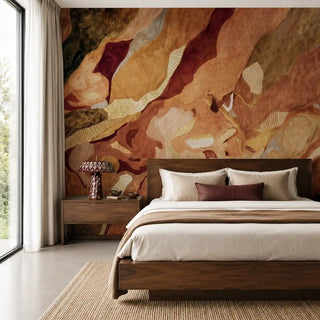 Magma in Ice wallpaper in Molten Amber as a bedroom feature wall behind a dark wood bed frame.