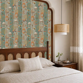 The Majestic Mewar green wallpaper mural installed on a feature wall in a bedroom with a dark wood cane headboard and rattan pendant light view-bedroom