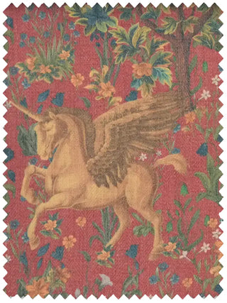 A high-resolution swatch of Majestica fabric featuring a golden winged unicorn in a floral forest on a rust-colored ground.
