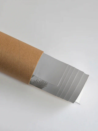 Premium protective shipping tube showing the rolled Malabar Kerala art print ready for delivery.