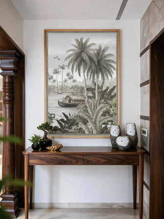 The Malabar Wall Art in Mist-Grey, framed and hung view-entryway above a wooden console with bonsai and ceramic vases.