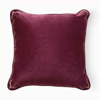 Full studio shot of the Golden Scallop Velvet Cushion with gold embroidered trim.