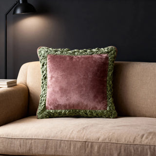 The Jhalak maroon cushion styled in a moody, dark-toned interior setting for a luxury look.