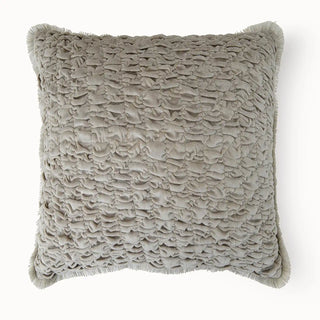 A direct front-facing view of the Maya cushion cover highlighting the uniform smocked pattern and neutral beige tone.