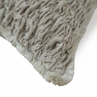A close-up detail of the Maya cushion cover showing the dense smocked velvet texture and eyelash fringe edge.