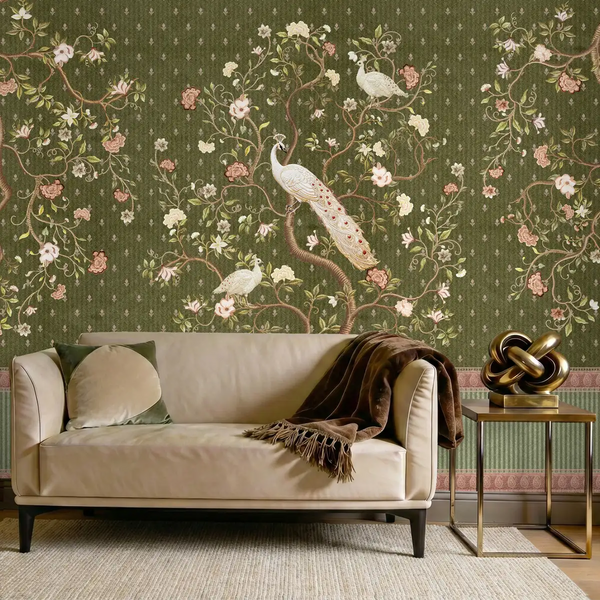 Mayura peacock wallpaper styled in a living room with a cream sofa and gold side table