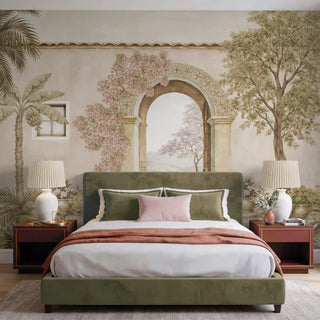 A vintage Mediterranean archway mural with pink bougainvillea behind a sage green velvet bed.