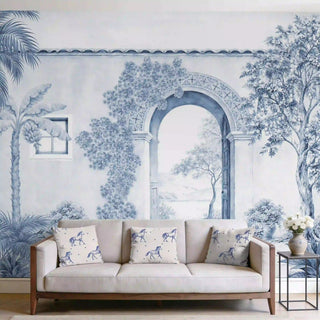 The Mexico customised wallpaper mural in Indigo & White, view-livingroom behind a beige sofa with horse-print cushions.