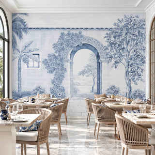The Mexico customised wallpaper mural in Indigo & White, view-restaurant behind marble dining tables and rattan chairs.