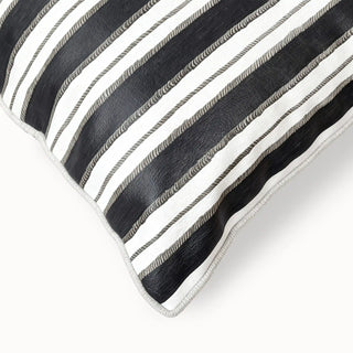 Close-up detail showing the black faux leather stripes, canvas texture, and twisted cord piping.