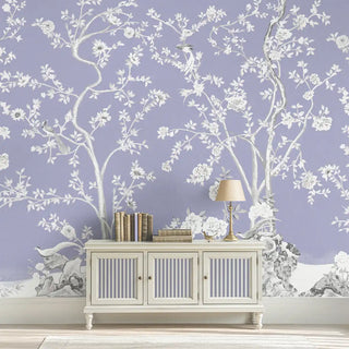 A wall view of the Mint Blossom Vintage Chinoiserie Wallpaper in lavender, showcasing its flowing botanical design with blossoms and branches.