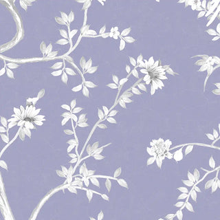 A close-up view of the wallpaper highlighting intricate hand-painted style blossoms and branches in white on the lavender background.