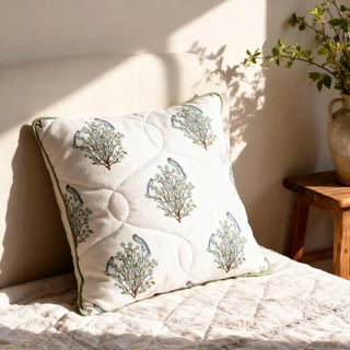 Mithoo Groove cushion styled on a bed with sunlight casting shadows, highlighting the quilted texture