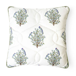 Front view of white quilted cushion cover featuring embroidered parrots and flowering branches.