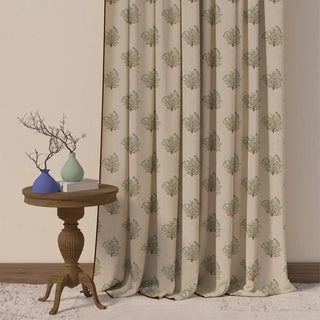 A full view of the Mithoo Pipin curtain, showing its repeating pattern of birds on branches in a subtle green and blue on a light background.