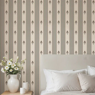 Bedroom styled with Modern Brown & Beige Arrow Stripe Wallpaper Roll, featuring beige background with vertical brown stripes and repeating arrow motifs, paired with a soft neutral bed and fresh white bedding.