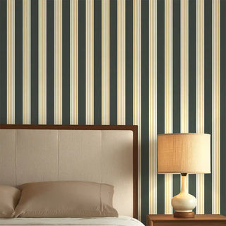 Bedroom styled with Modern Green & Beige Wide Stripe Wallpaper Roll, featuring alternating bold green and beige stripes paired with a wooden bed and warm lighting.