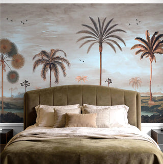 A luxury bedroom featuring the Mosslight Morning misty blue mural behind a velvet headboard with neutral linens.