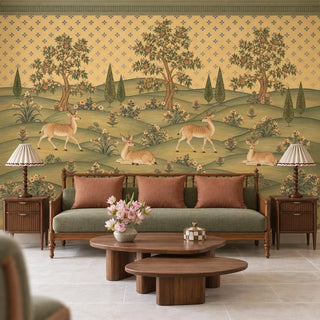 The Mriga Vatika wallpaper mural with spotted deer behind a wooden sofa with sage seats, rust cushions and two walnut coffee tables view-livingroom
