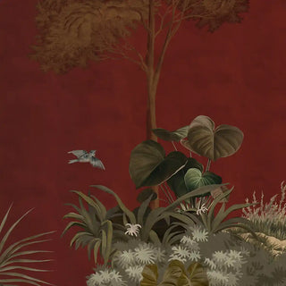 A close-up highlighting layered tropical plants, leaves, and detailed foliage against the maroon backdrop.