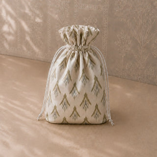 Nar pomegranate tiebacks cinching beige patterned curtains on carved wooden window frames