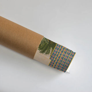 The Nauka-Vihar wall art print partly unrolled from its kraft paper tube, revealing the blue floral border.