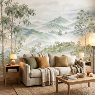 The Nilgiri landscape wallpaper mural installed on a feature wall inside a formal dining room with a solid wooden dining table set.